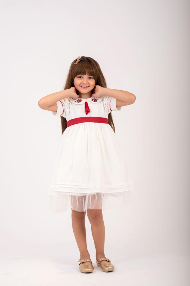 Arya's white embroidered dress