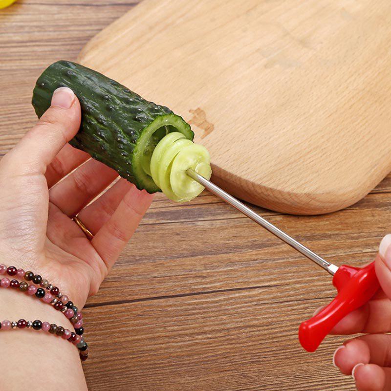 A kitchen tool for spiralizing vegetables. Plastic + stainless steel