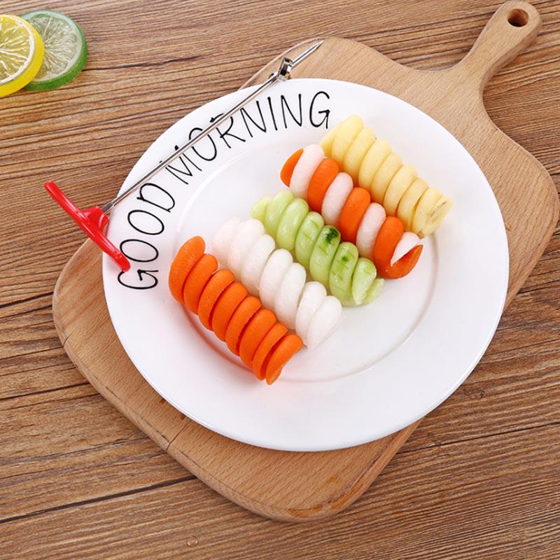 A kitchen tool for spiralizing vegetables. Plastic + stainless steel