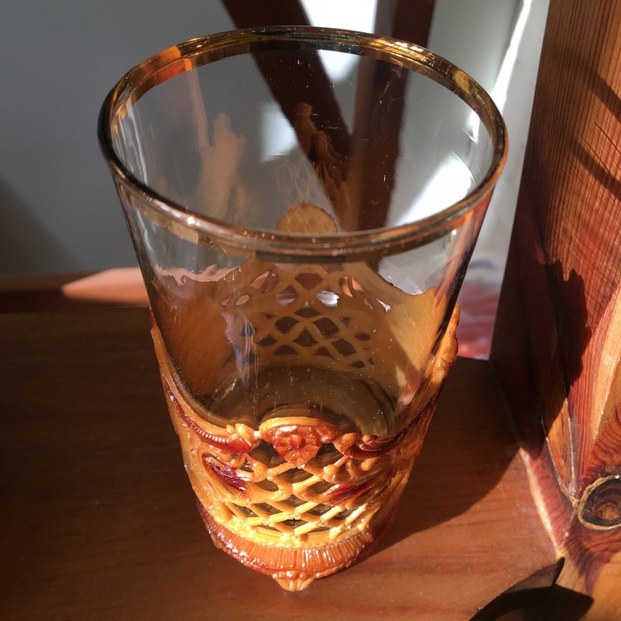 Vintage glass cup with a plastic base