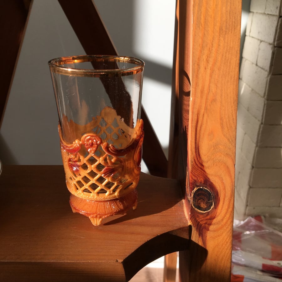 Vintage glass cup with a plastic base