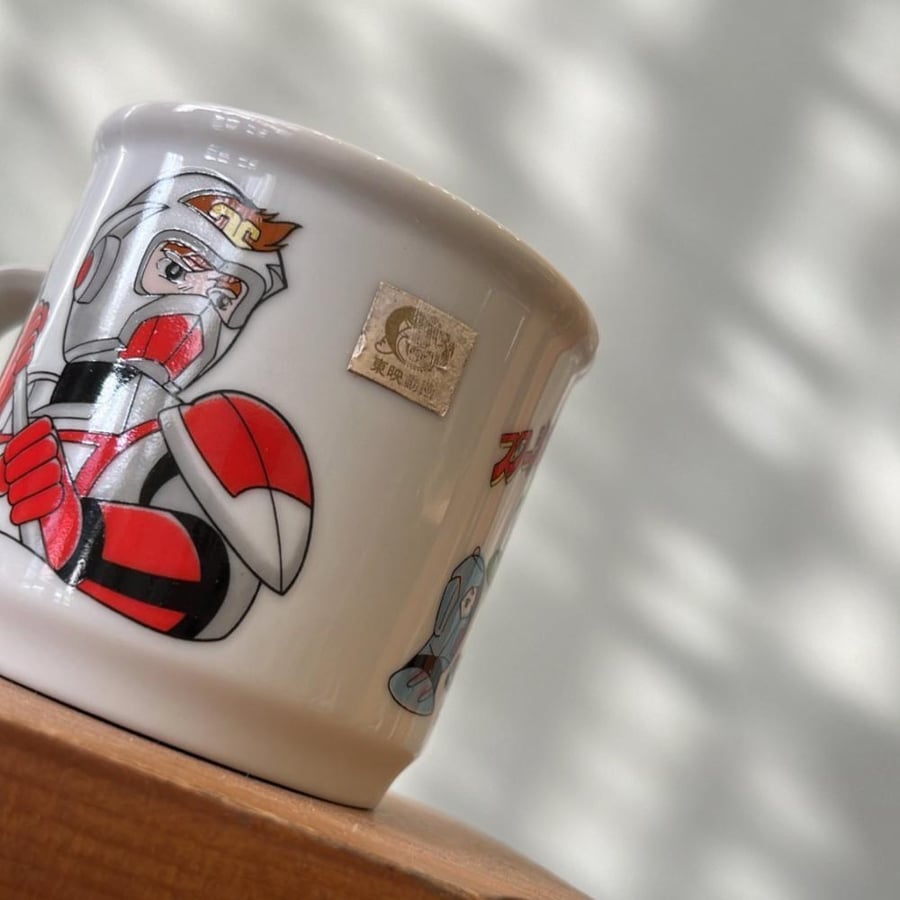 Vintage ceramic mug featuring characters from the Japanese anime series Starzinger.