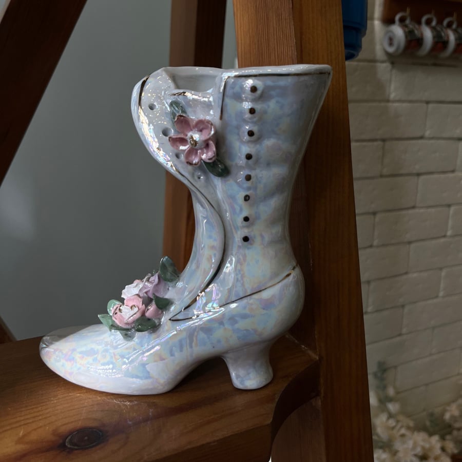 A masterpiece and a vintage vase in the shape of a shoe