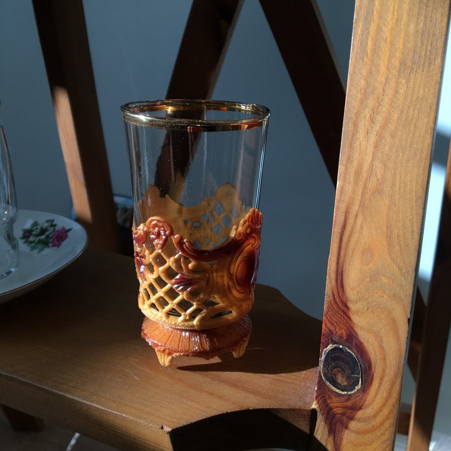 Vintage glass cup with a plastic base