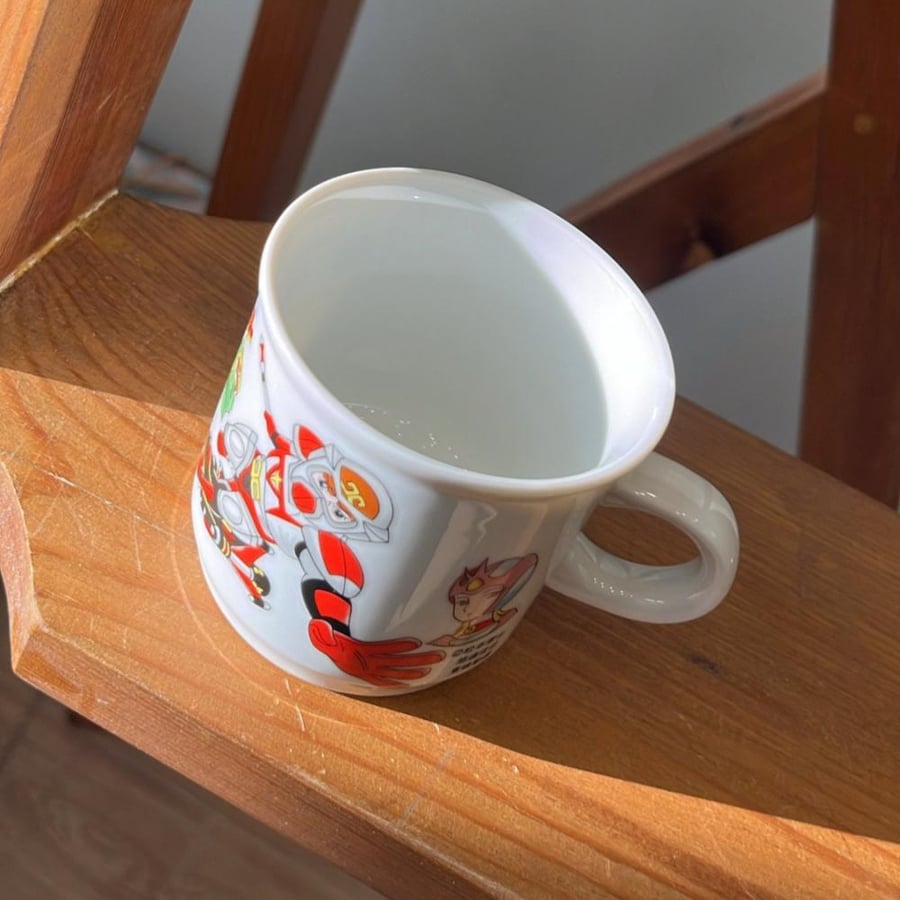 Vintage ceramic mug featuring characters from the Japanese anime series Starzinger.