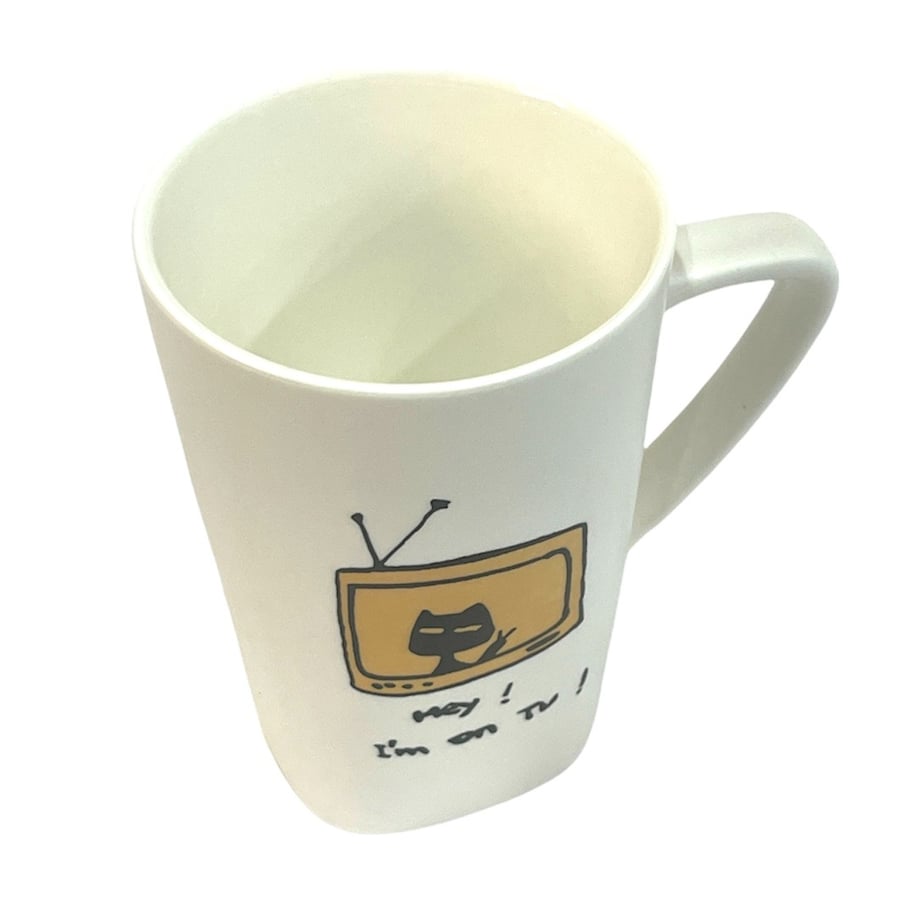 كوب قهوة بغطاء وملعقة