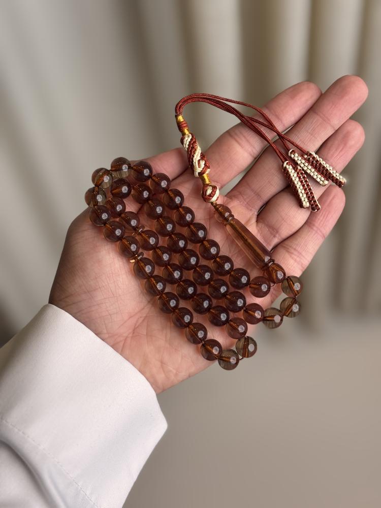 سبحة بكلايت بني شفاف شكة بني مع ابيض