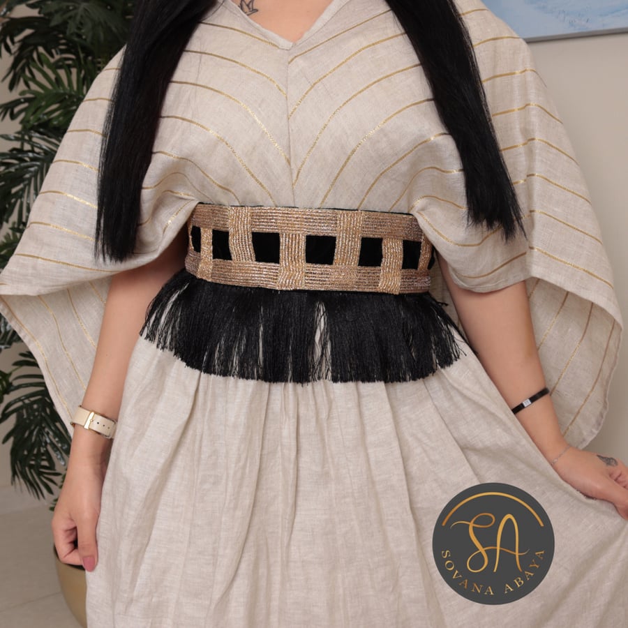 Be unique and eye-catching with the new limited edition collection of Sofana jalabiyas, made of a blend of luxurious fabrics. Elegant 3-piece jalabiya (dress - belt - jalabiya).