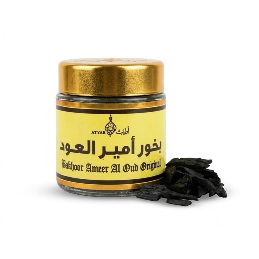 كسر بخور امير العود بجانب البرطمان الزجاجي اطياب