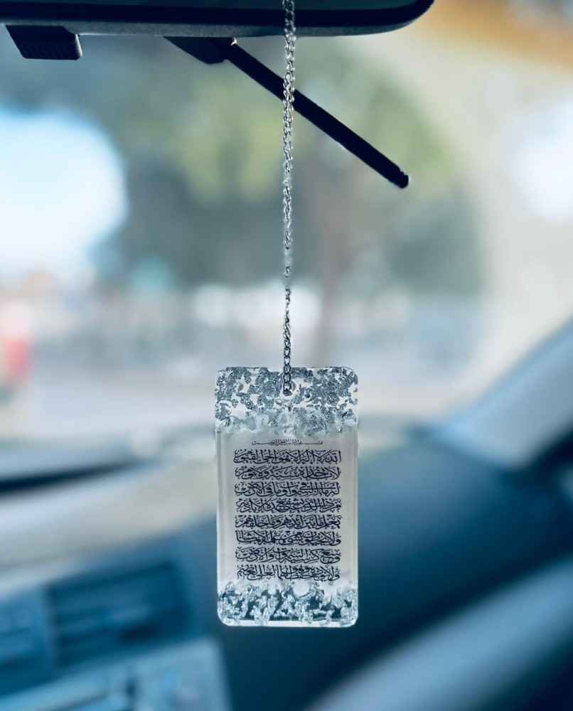 A double-sided car pendant with an elegant design made of luxurious resin