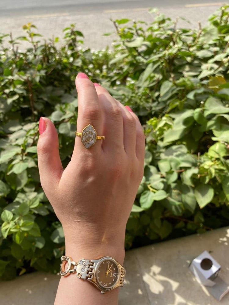 Women's brown ring with small stone
