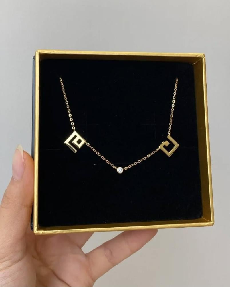 A two-letter necklace with an elegant zircon stone.