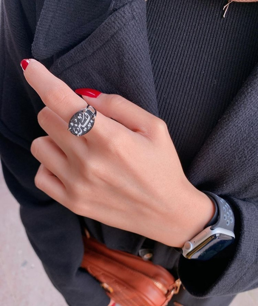 Silver ring encrusted on the sides with zircon