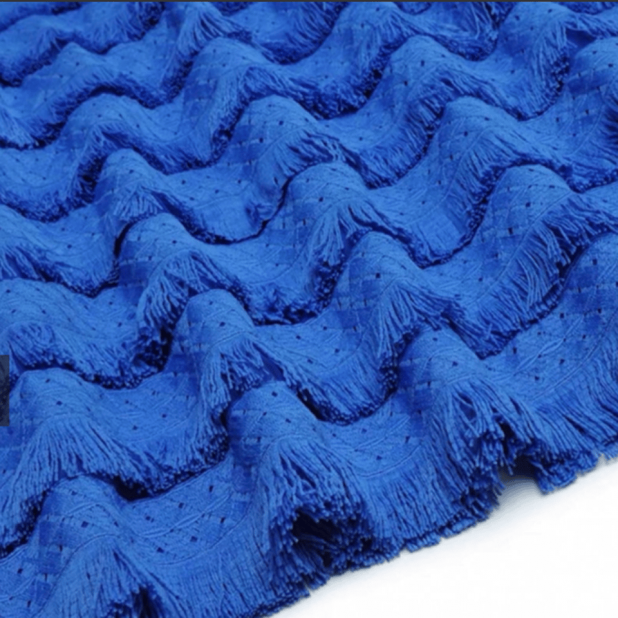 A navy dress decorated with beautiful fringe and lace