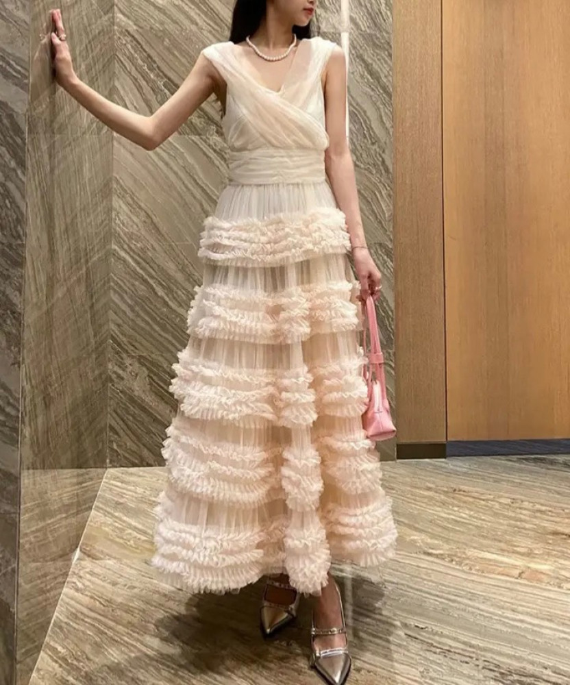 European dress decorated with tulle and wonderful chiffon with a draped design to highlight the beauty of the waist