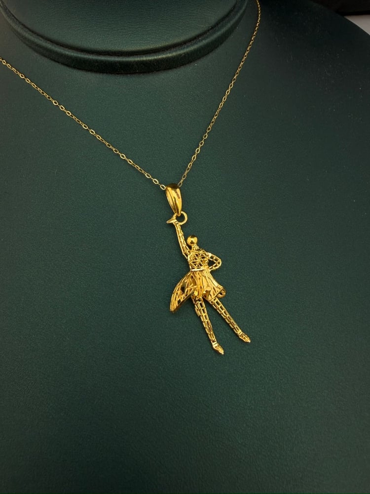 Gold ballet dance necklace, 21 karat, luxurious and distinctive, weight 3.19 grams.