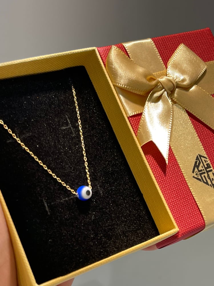 Thank you, the eye is distinguished and elegant, gold weight 0.60, 18 karat