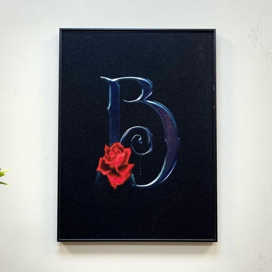 Wooden plaque with a frame for the letter B