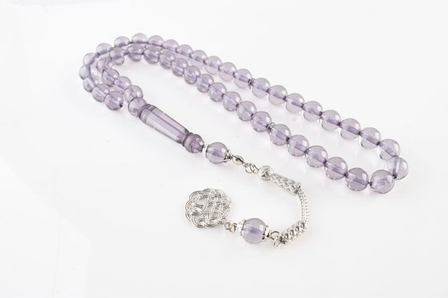 A tasbih with beads and luxurious metal