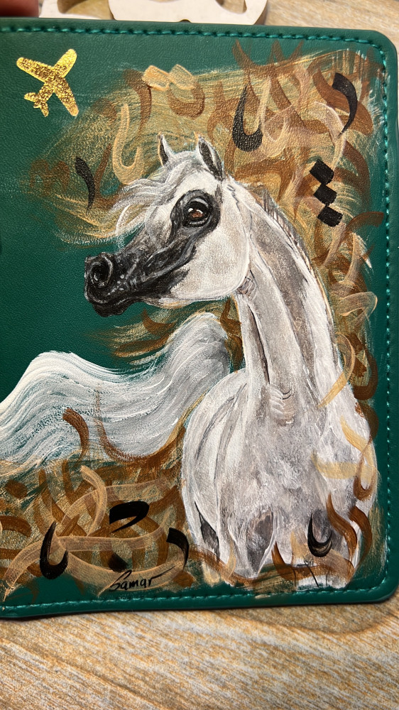 محفظة خيل وحروفيات