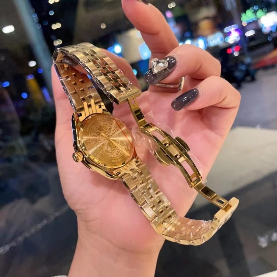 Golden and black Versace watch