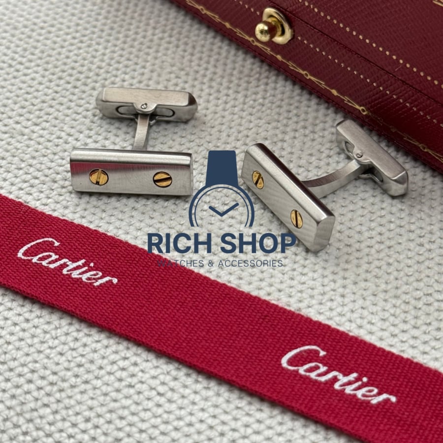 Silver Cartier cuff with gold screws