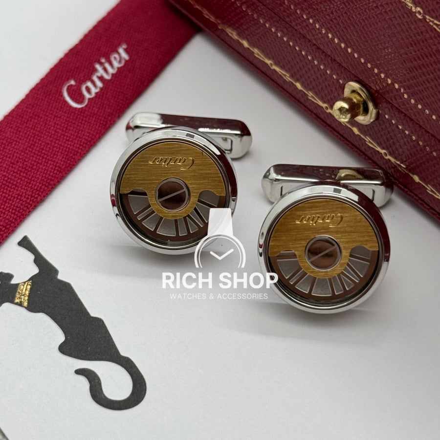 A silver Cartier cuff on gold