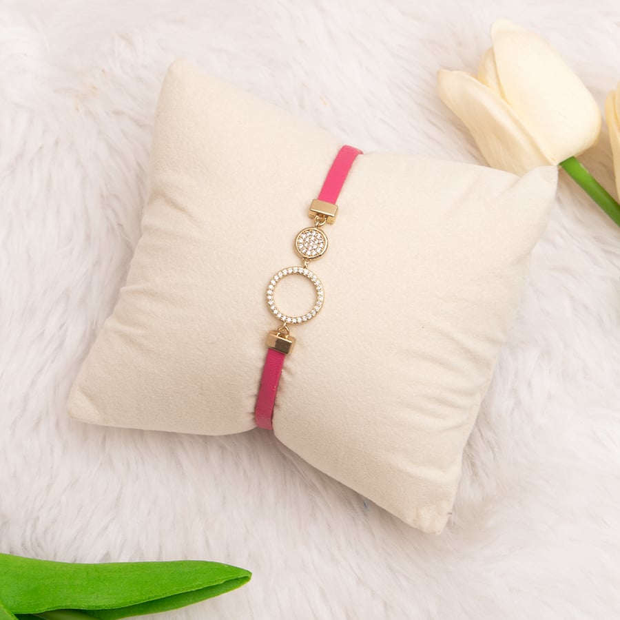 Women's bracelet with zircon in gold color with pink ribbon