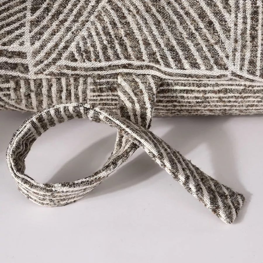 A distinctive pillow cover in brown and white