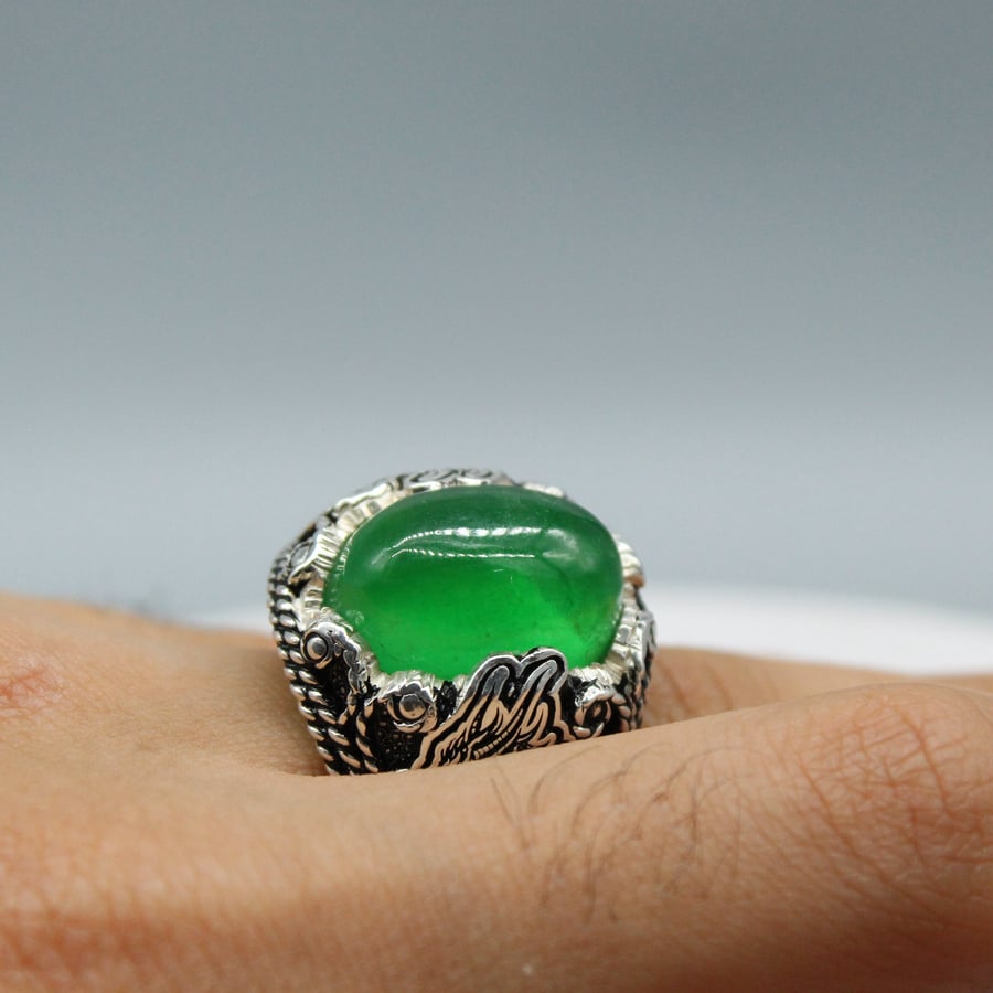 A serious Burmese natural ring with a girl of the wolf engraving