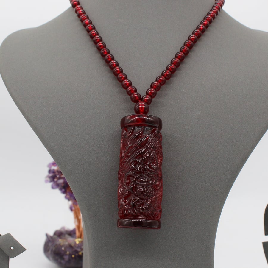 Baltic Amber necklace with dragon engraving