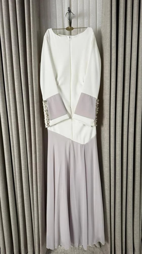 Off white long dress with straight cut and crystal embroidery on the sleeves