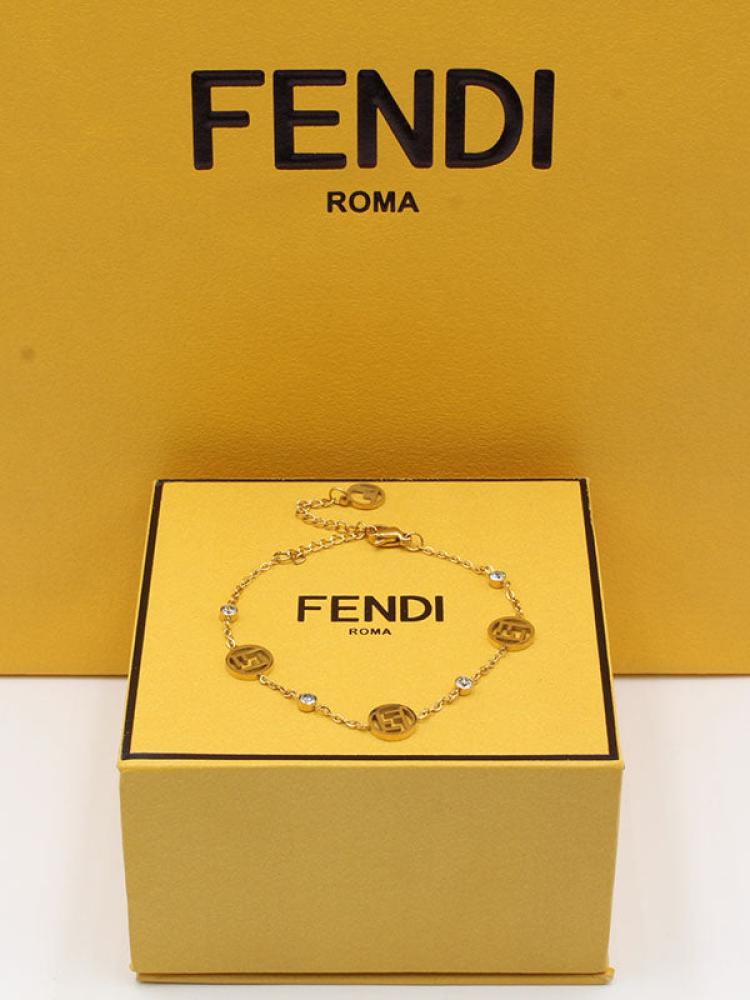 Fendi gold bracelet including accessories