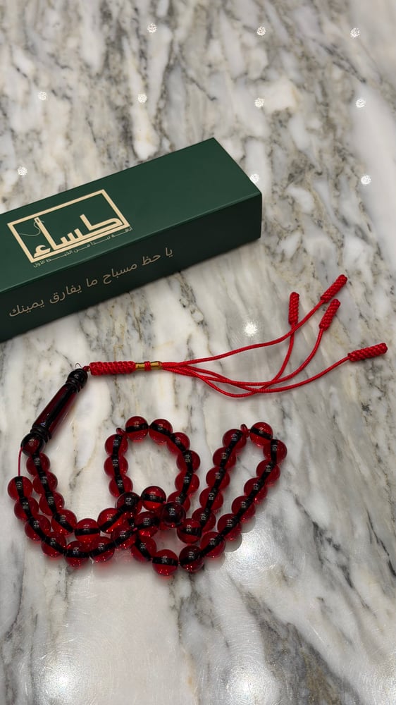 A prayer bead with a turquoise agate pendant