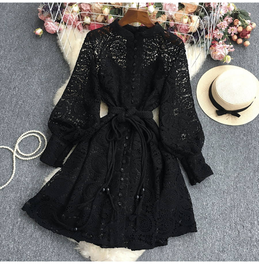 A short dress made of lace with an elegant belt