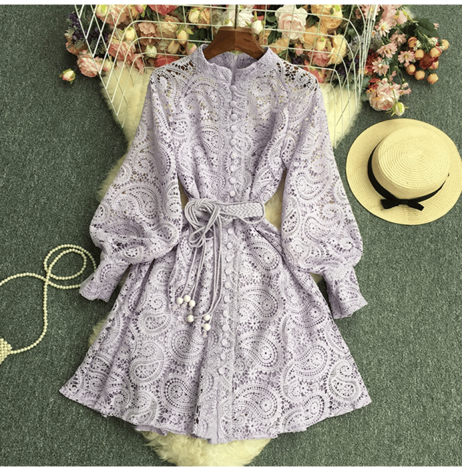 A short dress made of lace with an elegant belt