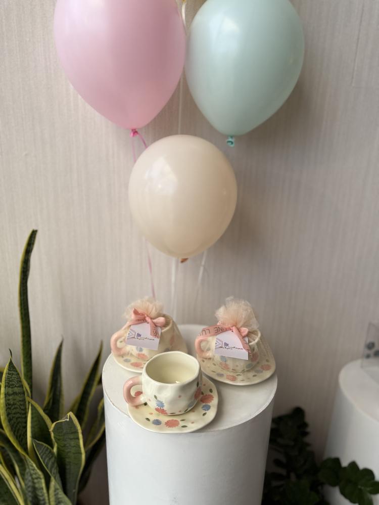 Eid gift (cup with plate) wrapped with fabric, ribbon, and card