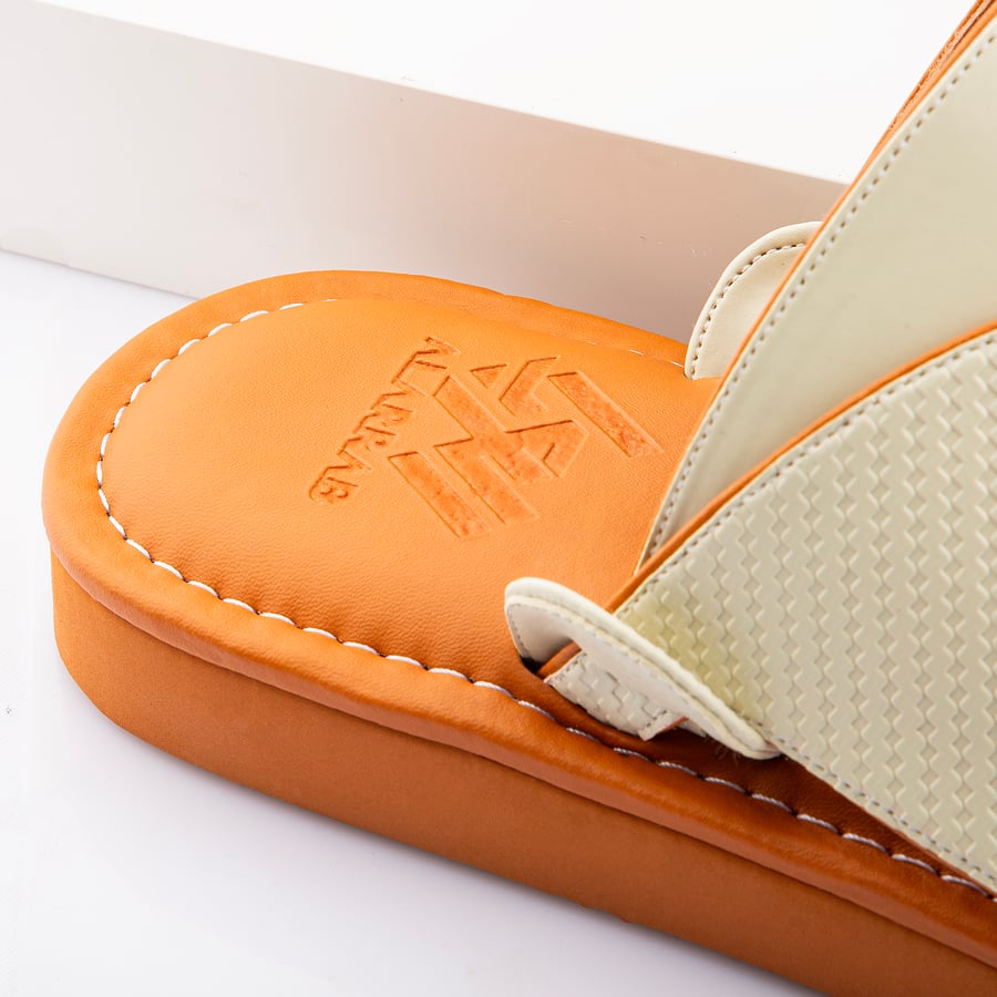 Eastern national slippers made of beige leather with a honey-colored medical sole