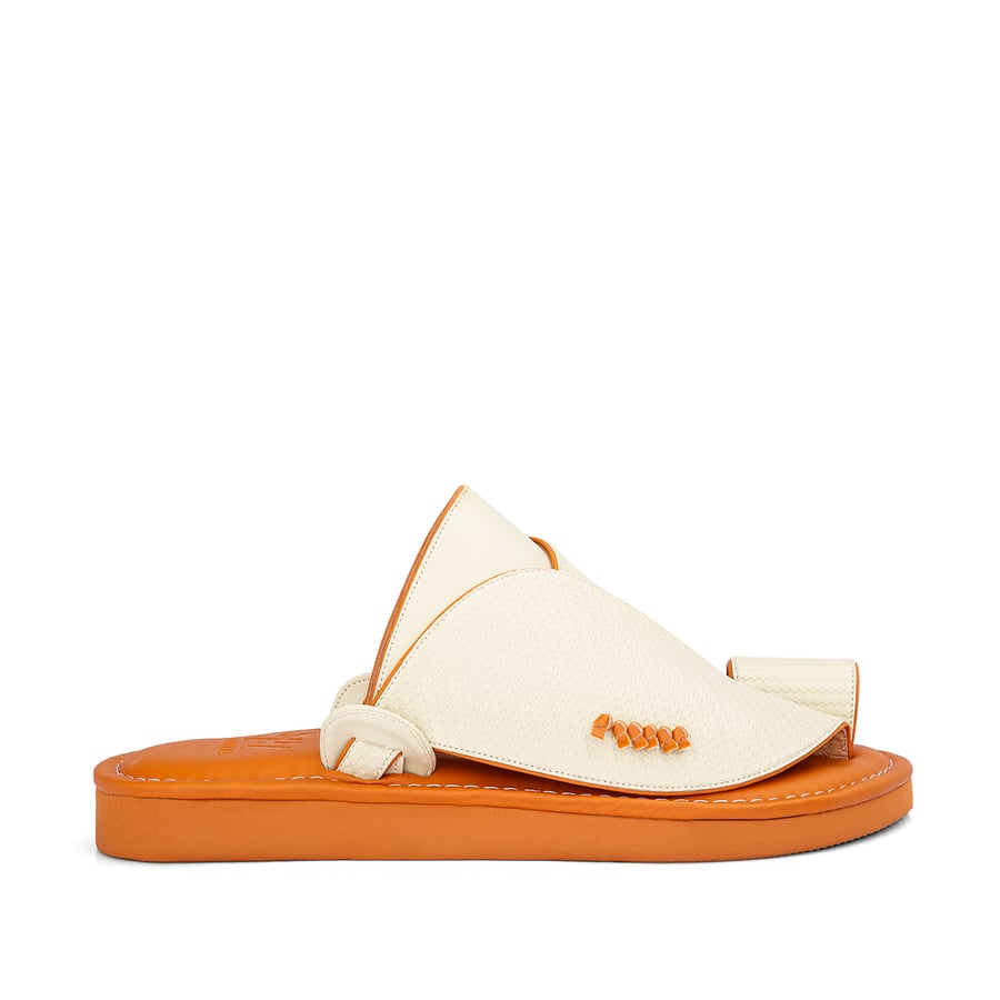 Eastern national slippers made of beige leather with a honey-colored medical sole
