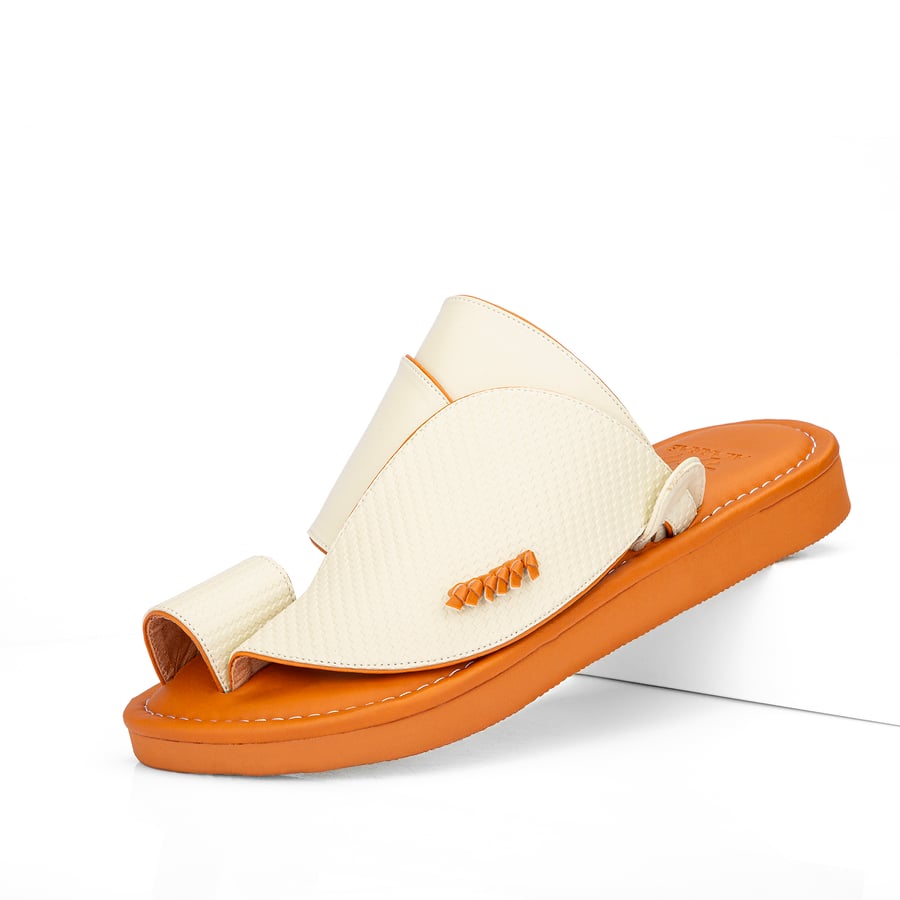 Eastern national slippers made of beige leather with a honey-colored medical sole