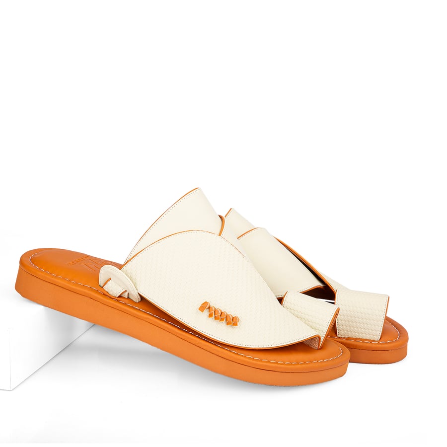 Eastern national slippers made of beige leather with a honey-colored medical sole