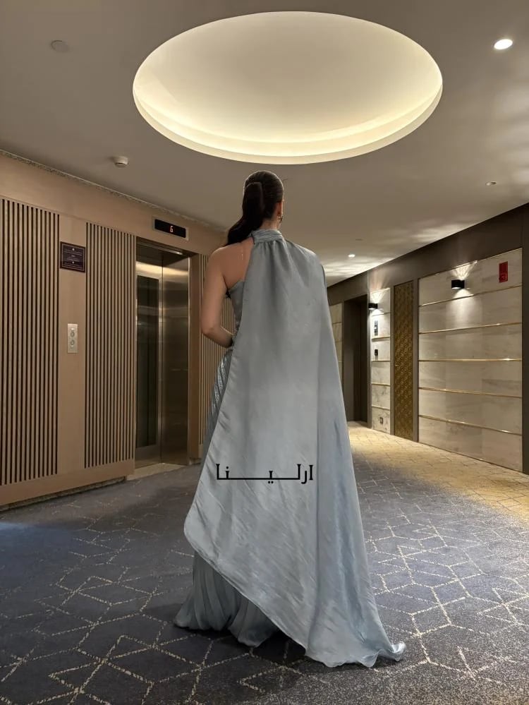 احدث فساتين ناعمه لون سماوي طويل.