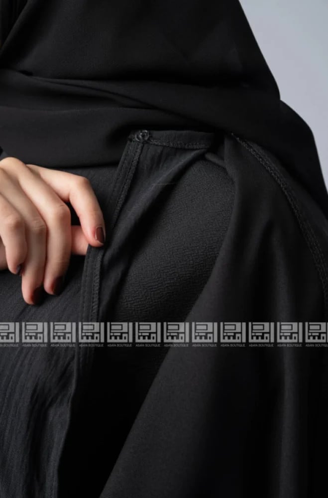 Black abaya embroidered with pearls with a connected dress design - 1526