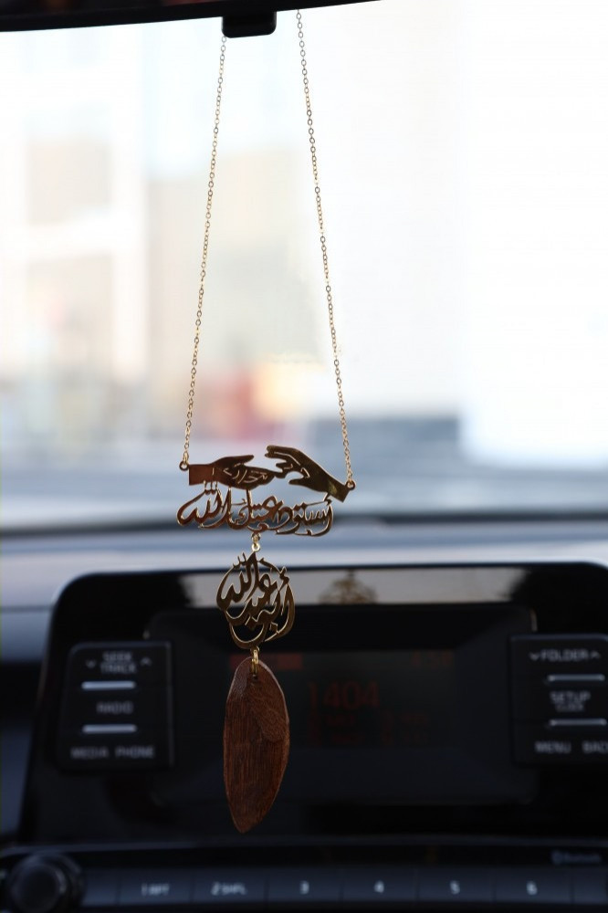 Car pendant with custom inscription.