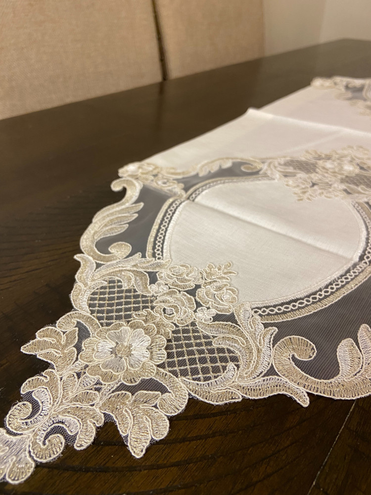 Golden lace tablecloth in the middle of the table
