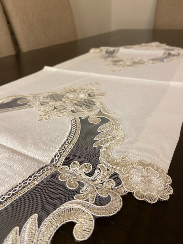 Golden lace tablecloth in the middle of the table