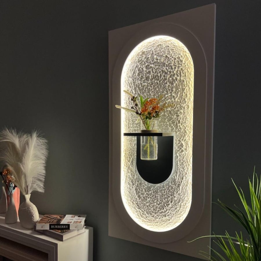 Illuminated wall panel with an arched design and a glass flower shelf
