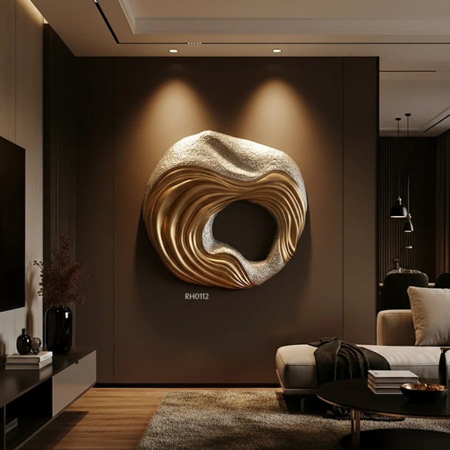 A three-dimensional abstract gold wall piece – a touch of modern luxury that adds depth and elegance to your wall with a modern design.