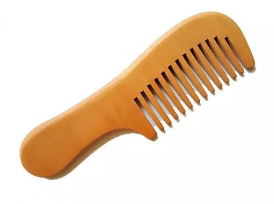 Natural wood comb absorbs negative ions