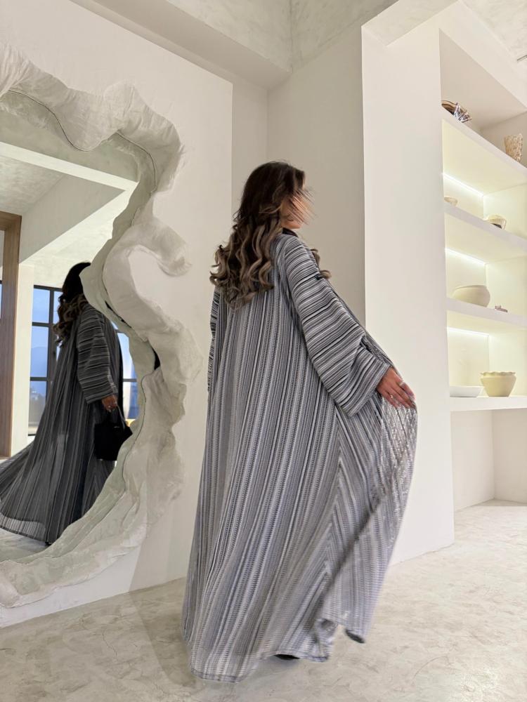 A cloak made of torn lightweight wool fabric, front cut, padded in black
